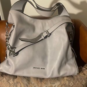 Cute Michael Kors purse for multiple purposes and very convenient to carry.